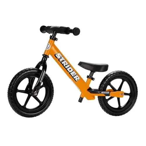 Strider 12 inch balance bike in orange color with adjustable seat and handlebars