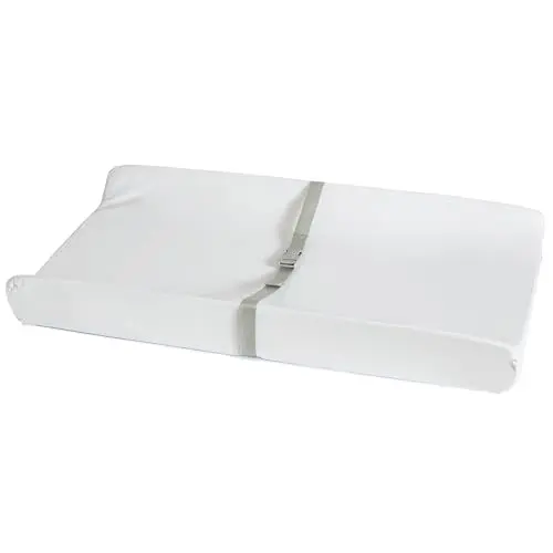 Munchkin Secure Grip waterproof changing pad with contoured sides on a nursery dresser