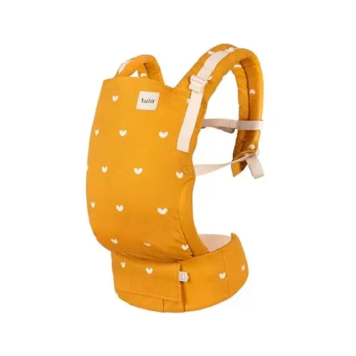 Baby Tula Free-to-Grow baby carrier in yellow with hearts pattern