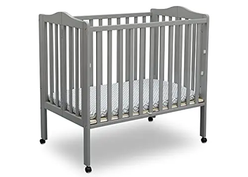 Delta Children folding portable mini crib in grey color