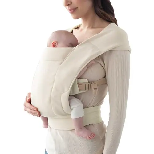 Ergobaby Embrace baby carrier wrapped around a parent with newborn