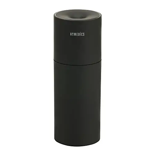 Homedics black portable humidifier with accent light on desk