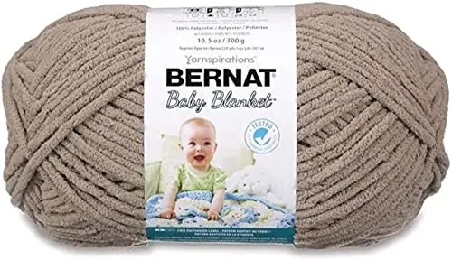 Bernat Baby Blanket yarn in baby sand color showing soft chenille texture
