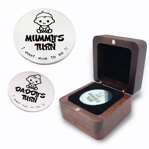 Silver decision coin in wooden box for new parents