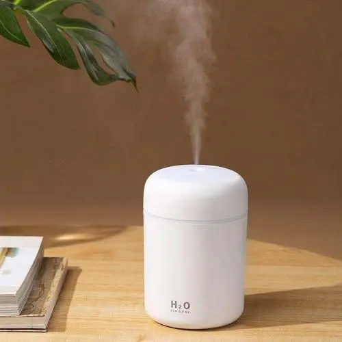 Saunana white portable humidifier with colorful lights on desk