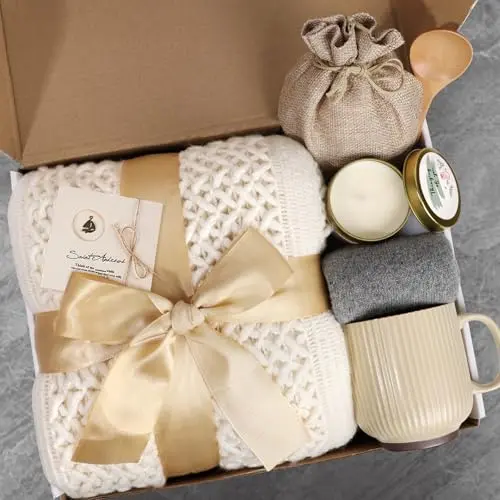 Ivory self-care gift basket with blanket, mug, and spa items