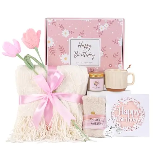 Birthday gift basket with knitted blanket, ceramic cup, fuzzy socks, and scented candle